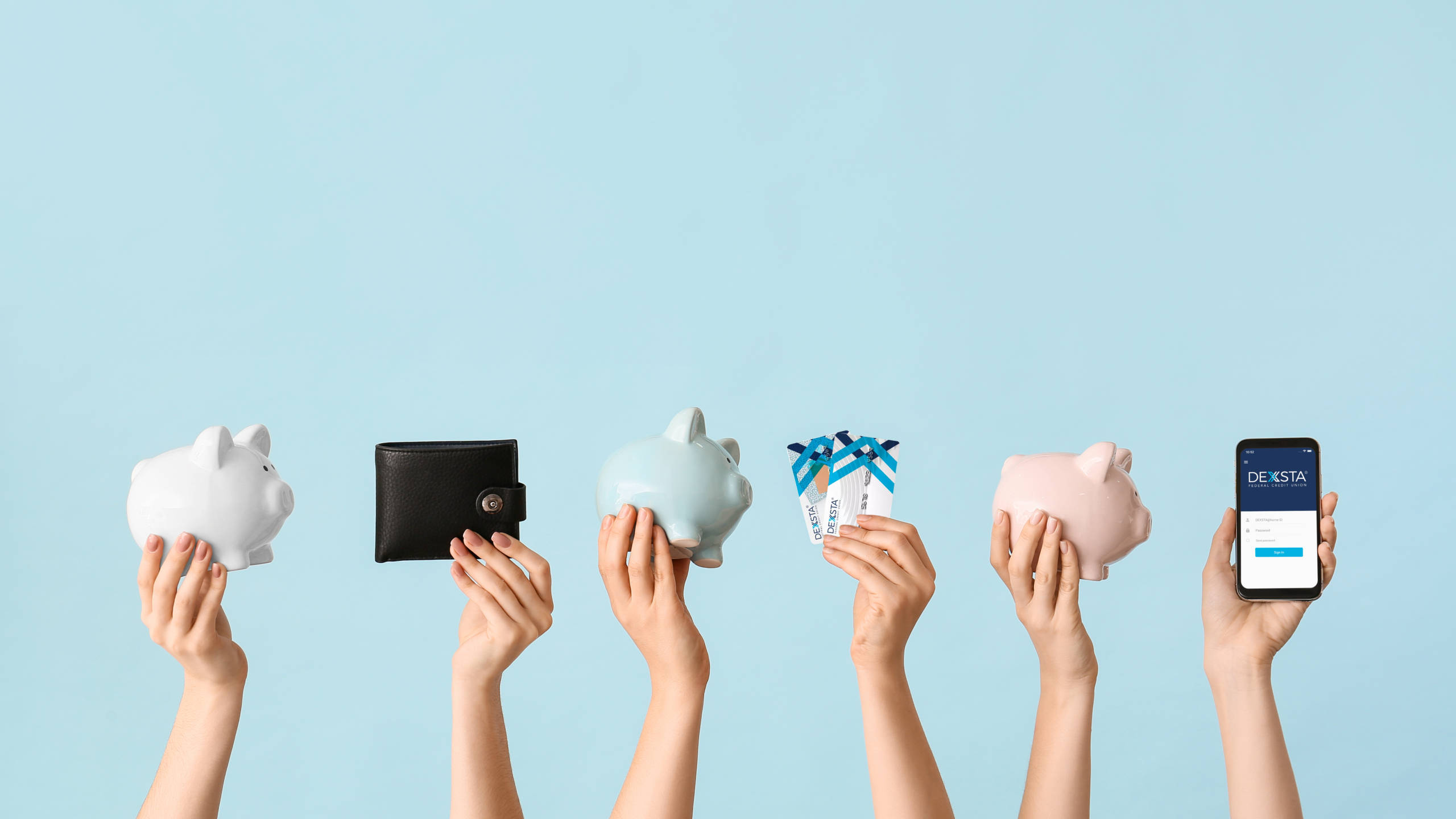 customers holding up bank related items, showing their enjoyment of the perks from the best credit union in De