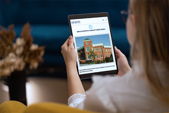 woman holding iPad looking at image of local credit unions
