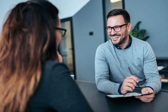 A hiring manager interviewing a job candidate at one of the DEXSTA locations