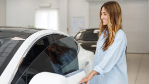 Woman getting into car for a blog about buy now pay later cars